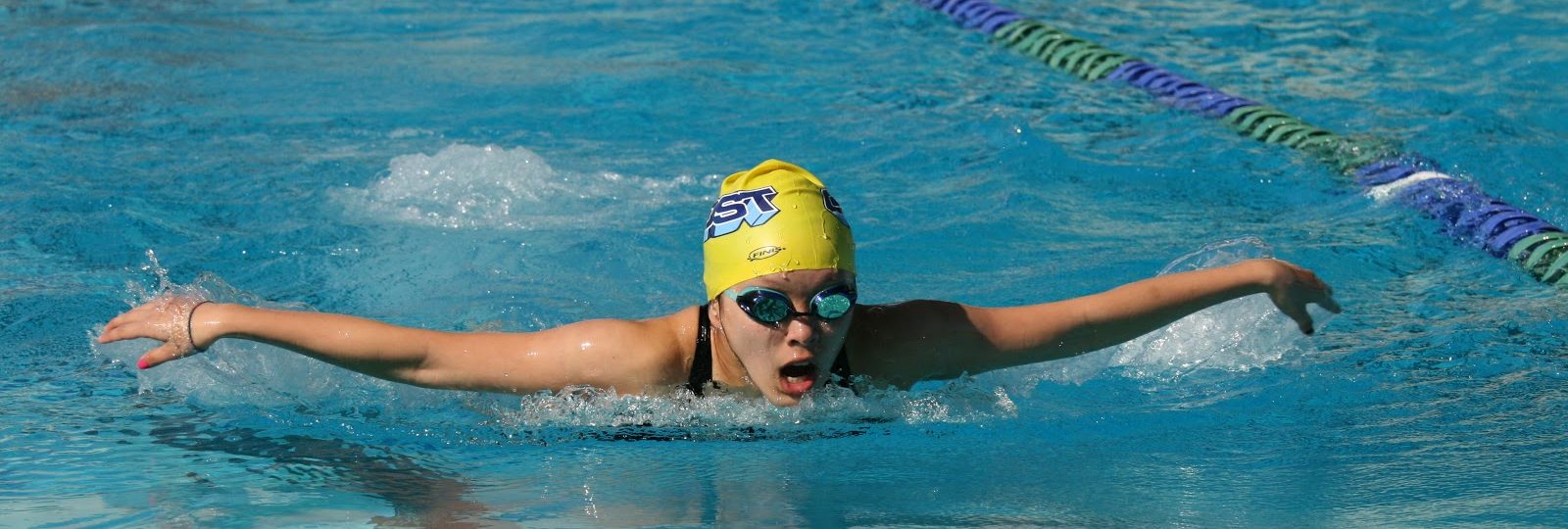 A student is practicing butterfly stroke