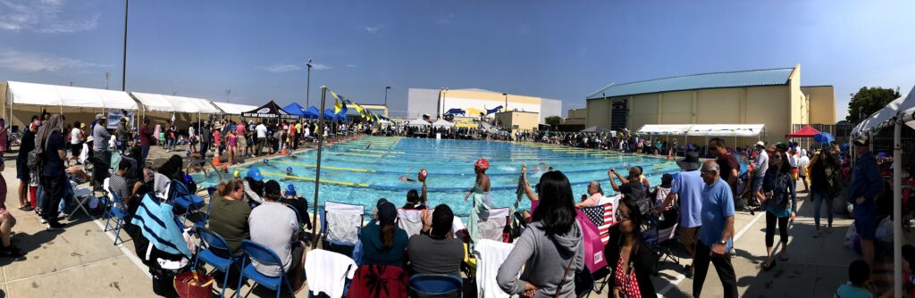 This picture shows a crowed pool facility of a swim meet